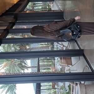 Billie Backpack in pebble leather, featuring two external pockets